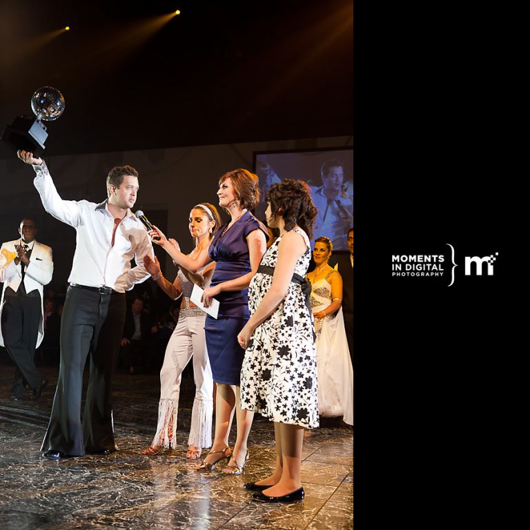 Bryan Mudrik from TSN hoists the 2010 Mirror Ball trophy as the winner of the Dancing for the Kids event in Edmonton