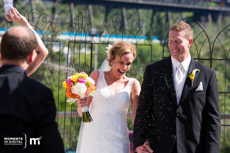 Guests throw lavender at the Bride & Groom after their wedding ceremony