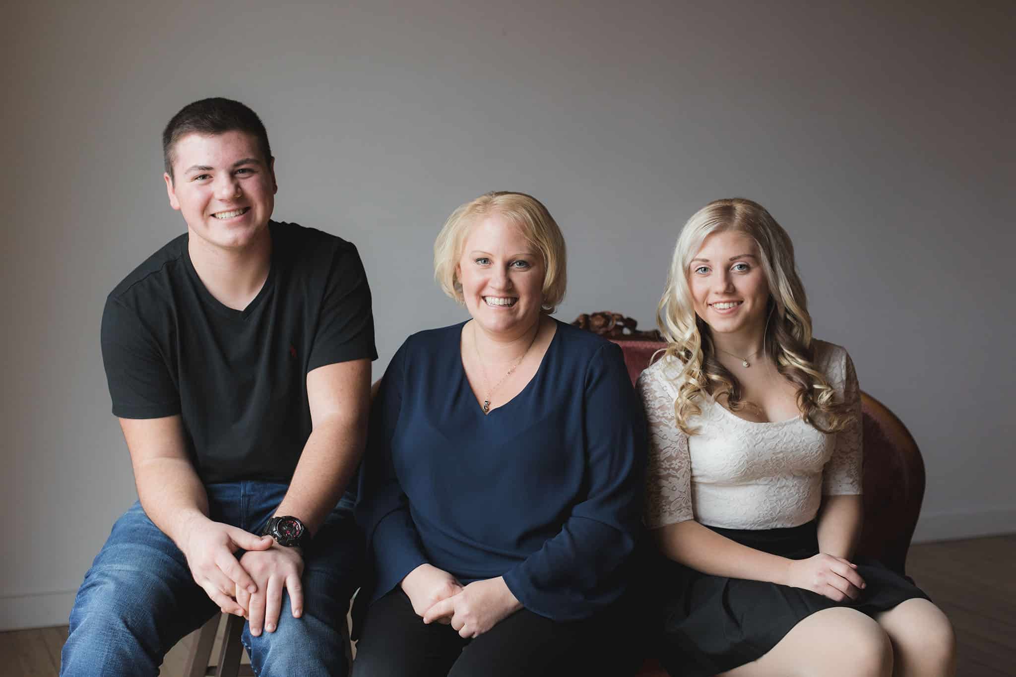 20161117_Shedney_Family_109 Event planner Caitlin Mcelhone standing beside decorated gala table during Edmonton charity event setup