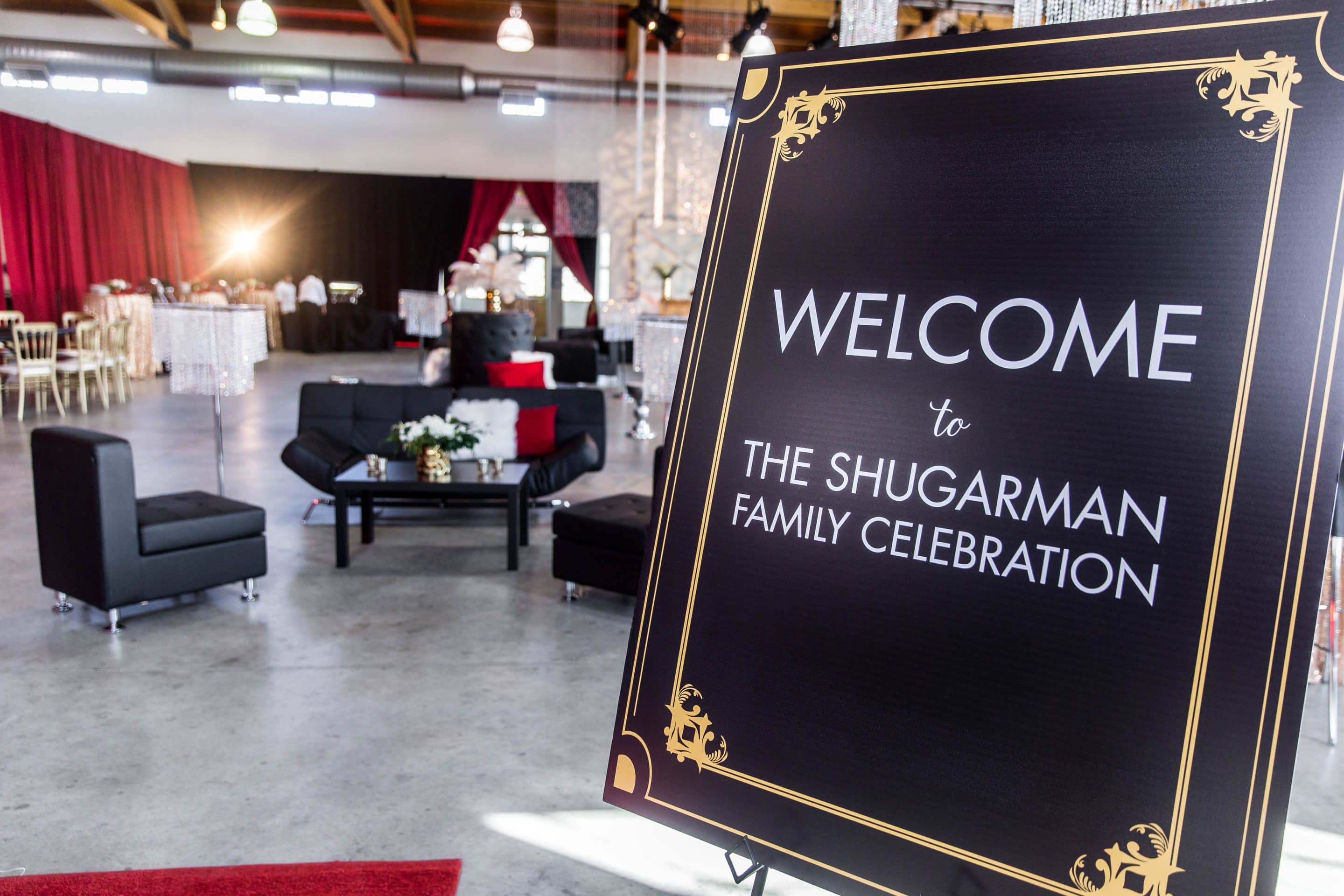 20150418_Shugarman_Celebration_010 Entrance signs and decor welcome guests to the Shugarman family celebration at the aviation hangar in Fort Edmonton Park