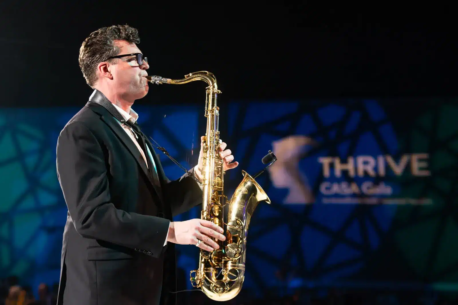 edmonton-event-photographer-CASA-Gala-162-1600 Live saxophone performer entertaining guests at an Edmonton gala event